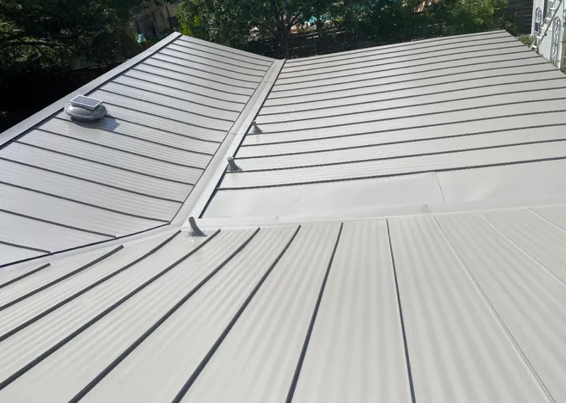 Solar attic fan installed on a metal roof for Roof Ventilation in Big Bear City